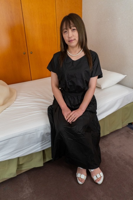 Mature Japanese Lady Strips Naked & Shows Off Her Big Ass In Her Hotel Room