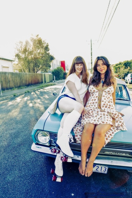 On the go: Lesbian woman Kara Dasna (left) and her hot girlfriends show off their tattoos while enjoying themselves outdoors.