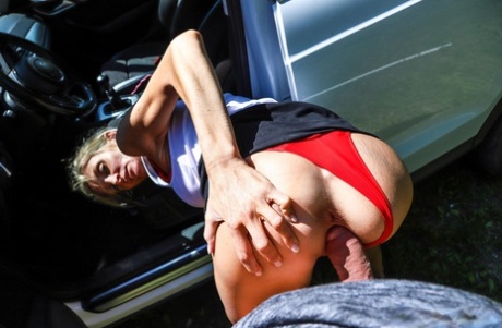 Mia L, the mischievous blonde, exposes her crotch and is sexually stimulated in a car.