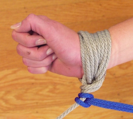 During her stint as a Bondage hotty, Rhiannon Bray is subjected to whipping while tied up.