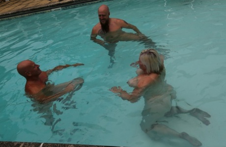Chubby granny Lacey Starr swims with her kinky FMM threesome.