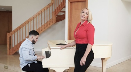 Mellanie Monroe, a piano instructor, seduces a student with her big fists and makes him giggle.