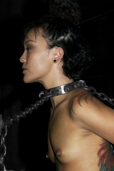 Asian babe Jandi Lin gets chained and punished by her harsh master