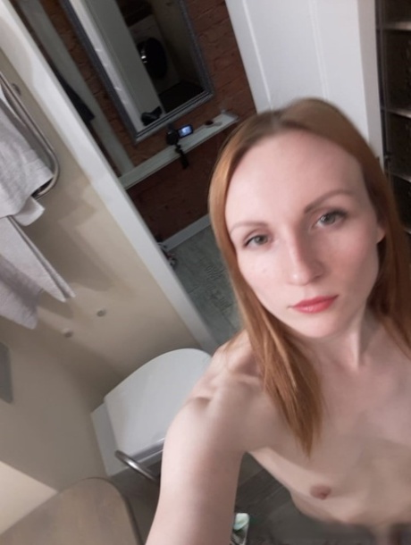 Looking good: This amateur ginger looks very skinny and has small breasts, as seen in a mirror.