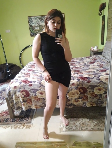 This amateur doll exposes her enviable curves while stripping and posing in the mirror.