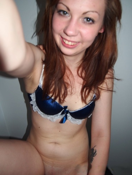 Sweet amateur babe takes selfies of her inked body and small boobs