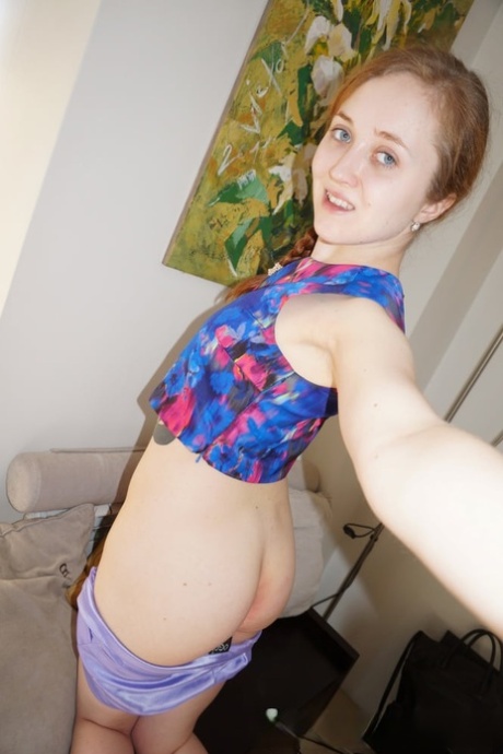 Petite amateur teen stripping and posing naked in front of the mirror