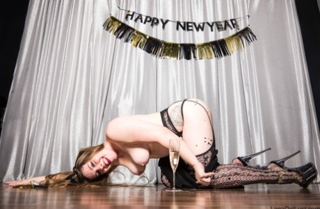 Lana Del Lust, despite being an amateur stripper, strips and poses for photos during a New Year's solo performance.