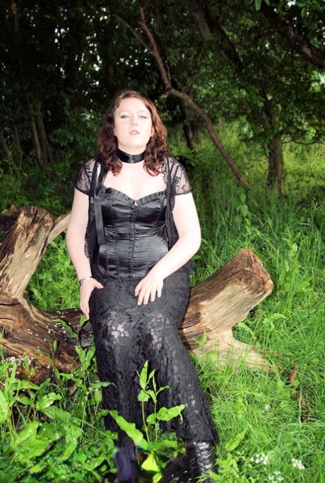 Beauty queen: Chubby brunette MILF in nature wearing an elegant satin and lace outfit.