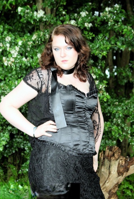 In nature, MILF, a plumper brunette with dark hair, was seen wearing an attractive satin and lace ensemble.