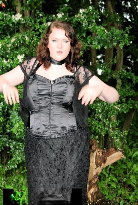 MILF, the slouchy brunette, was captured in nature wearing an attractive satin and lace ensemble.