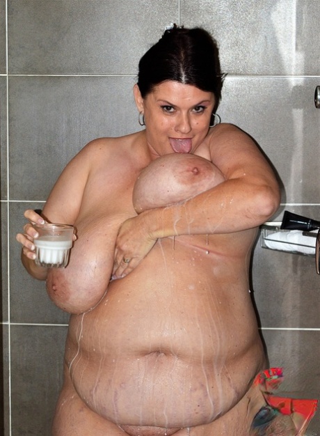 Kaboom, the brunette, enjoys a shower with her milk and big breasts.