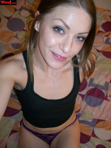 Blue-eyed babe WouJ is seen here in her bedroom wearing lacy purple undies and a black top.