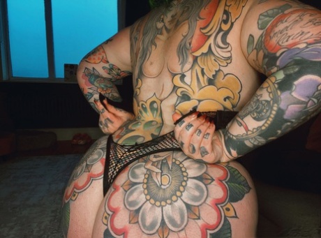 Big tits: Galda Lou, who is heavily tattooed, shows off her fat thighs in black lingerie.