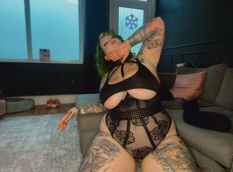 Heavily tattooed fatty Galda Lou shows off her big tits in black lingerie