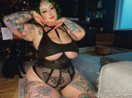 Heavily tattooed fatty Galda Lou shows off her big tits in black lingerie