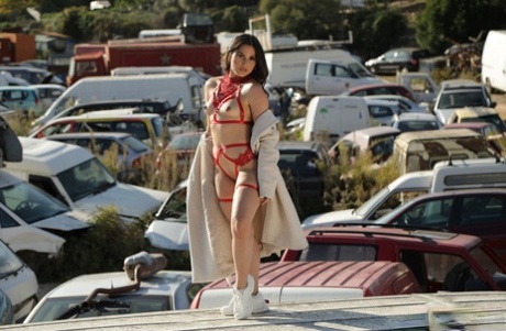 Ariana Van X undresses in her car with an overused buttocks at the scrapyard.