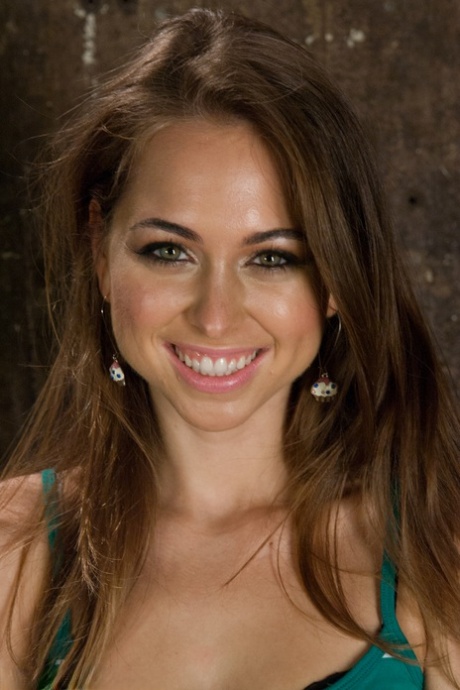 Brunette cutie pie Riley Reid reveals her bush and tiny tits in a basement