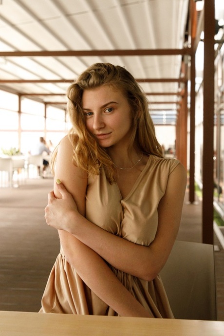 Regan Budimir, a Ukrainian babe, displays her substantial breasts while posing in front of the mall.