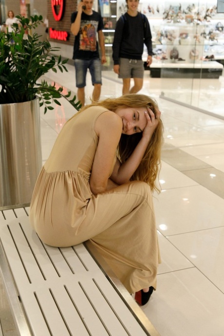 Regan Budimir, a Ukrainian girl, poses for her big siesta at the mall.