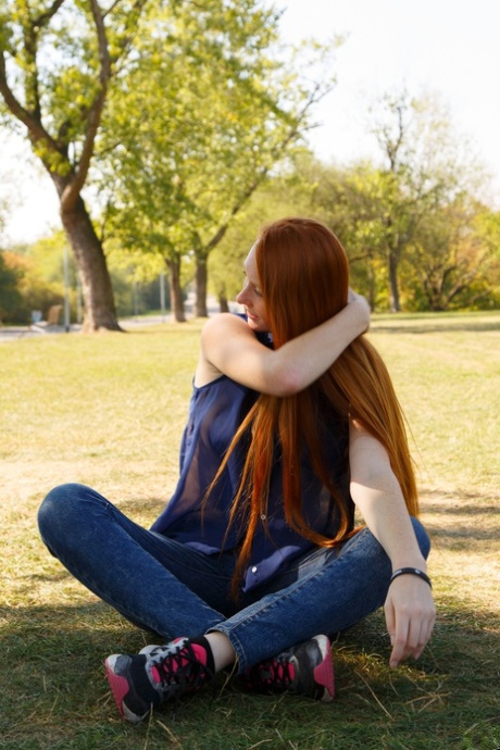 Exhibiting her big asses and natural tits, Petrine Krahlove showcases her long hair as a redhead.