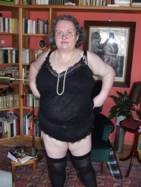 Fat mature woman Birgid strips her clothes & lingerie to show her huge body