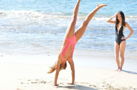 Scant: Smoked hot amateur bikini models Aubrey and Mary pose without clothes on the sandy beach.