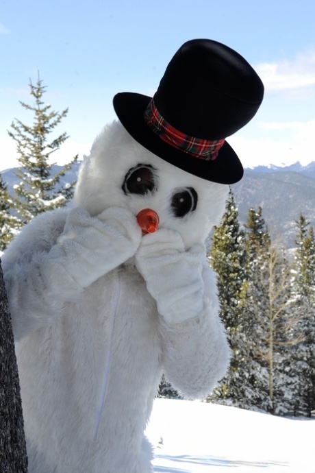Naughty Redhead Brandi De Lafey Gives A Snowman A CFNM Handjob In The Woods