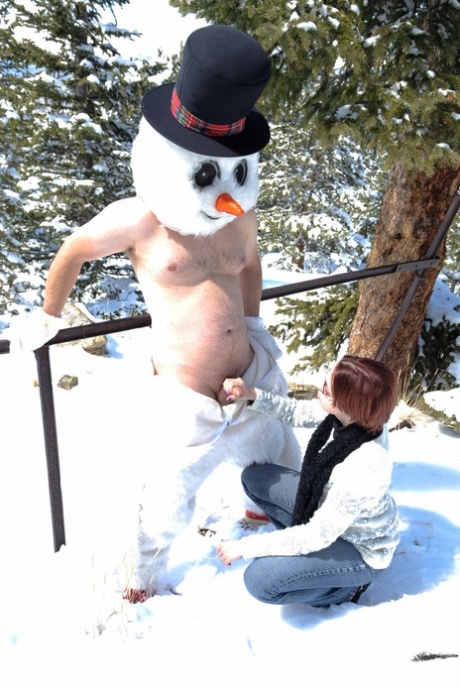Naughty Redhead Brandi De Lafey Gives A Snowman A CFNM Handjob In The Woods