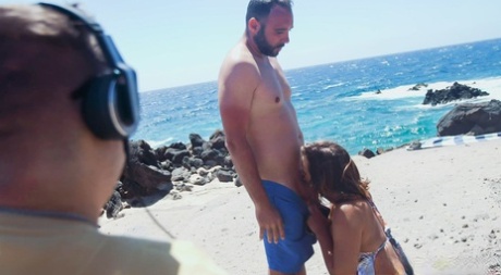 At the seaside, Czech girl Alexis Cherry enjoys a hot day with her husband who is overweight and watching over him.