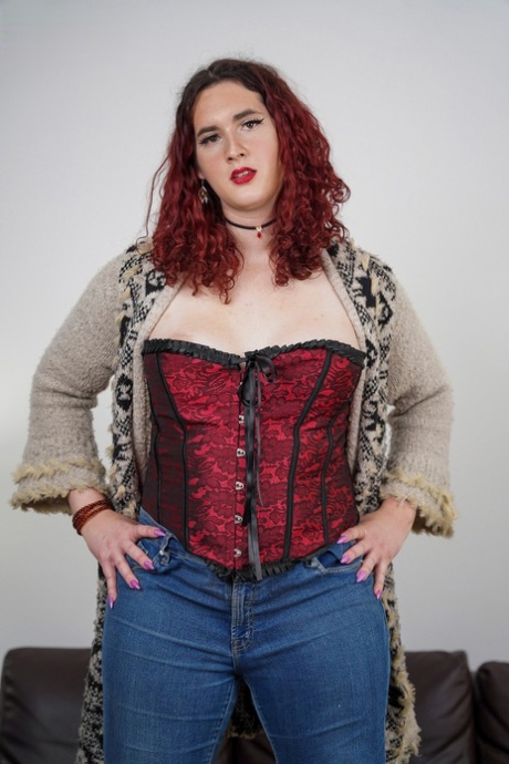 Curvy Redheaded Shemale Lily Fox Doffs Her Jeans And Shows Her Big Tits