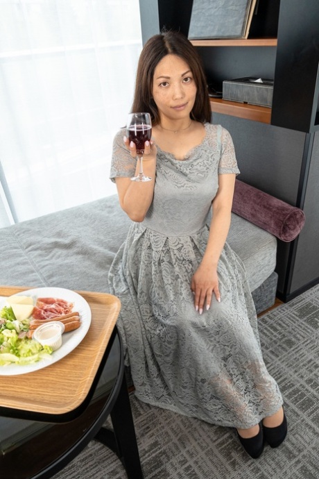 Cute MILF Midori Minami Strips Naked And Poses Enticingly In A Hotel Room