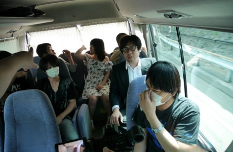 Naughty Japanese babe Tsuna Kimura unleashes his blowgun at the group of male passengers on the bus.