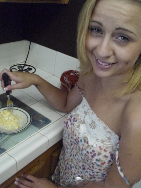 Pretty amateur wife Katty West strips and shows her big tits while cooking