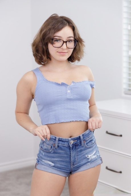 Nerd Leana Lovings Poses In Her Sexy Denim Shorts And Unveils Her Boobs