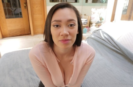 Madi Laine, an Asian female, exposes her large buttocks and natural tits on her bed.
