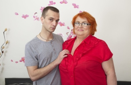 BBW Jara W, the red-headed ex-spouse, is given a mature pussy and fingering by a young man.