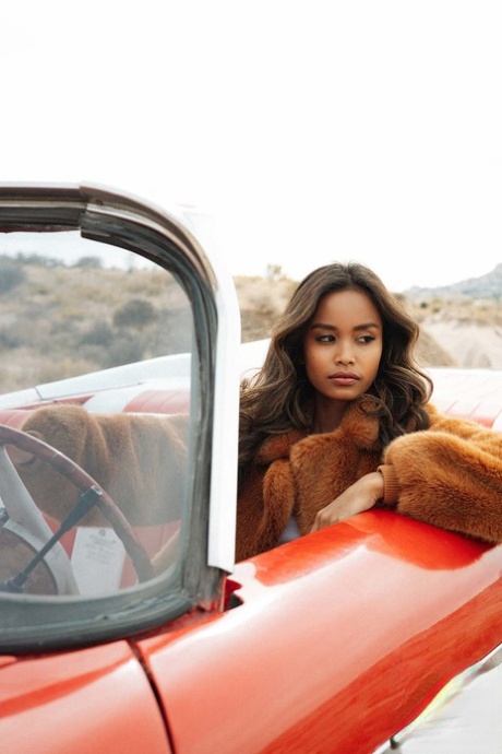 Cute Petite Spinner Reveals Her Amazing Boobs And Poses In A Red Car Outdoors