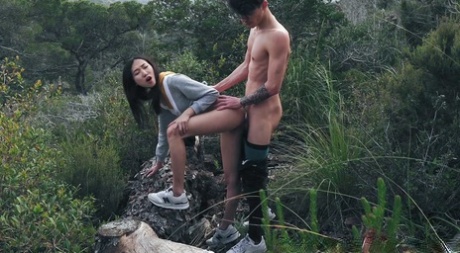 Sexy teen pornstar Luna X bends over a rock and gets rammed outdoors