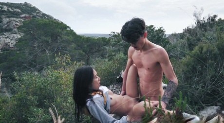 Sexy teen pornstar Luna X bends over a rock and gets rammed outdoors