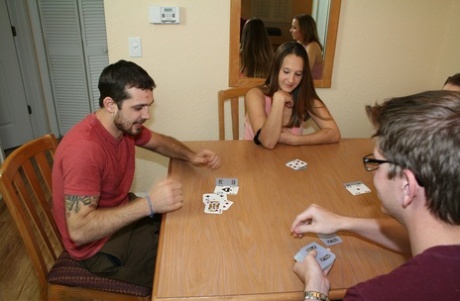 All-natural teens give a lucky nerd a double handjob while playing cards