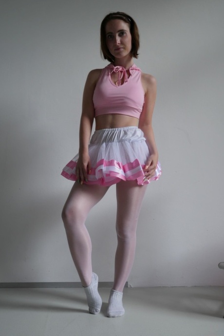 A brunette ballerina named Lia Louise teases her tutu while sucking into her dance instructor's penis.