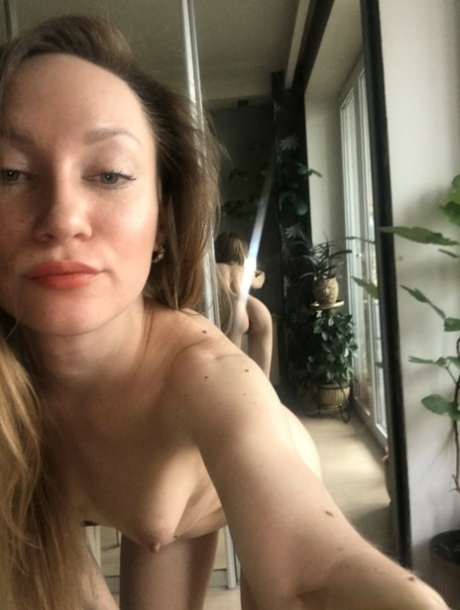 Katlynn, a thin amateur who is known for her freckles, displays her nude body positivity by taking daring selfies and spreading her pussy.