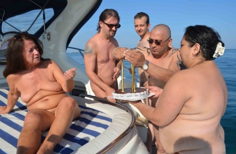 A yacht is used by an amateur GILF named Tinny Rados to sear her breasts on the occasion of her birthday.