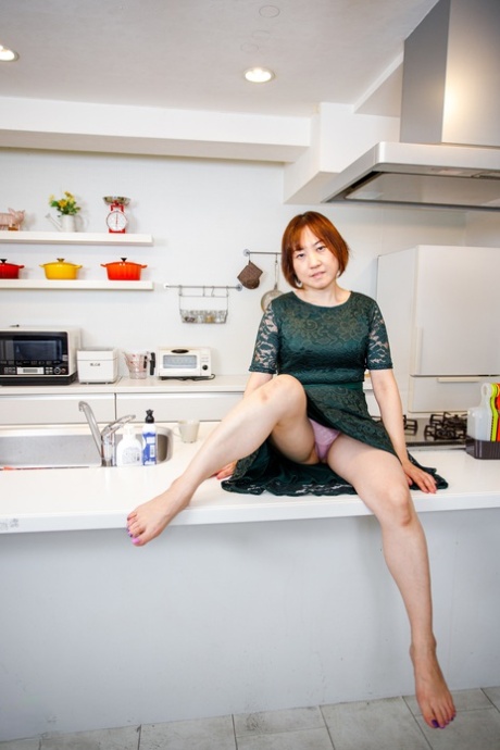 Asian Housewife Yuki Kozakura Shows Her Shaved Pussy In The Kitchen