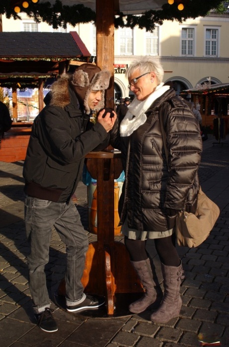 Short-haired German Housewife Flirts With A Young Man At The Christmas Market