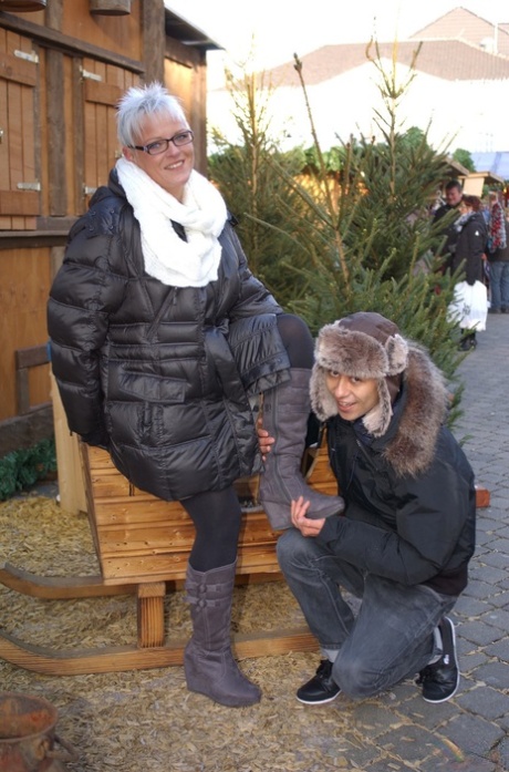 Short-haired German Housewife Flirts With A Young Man At The Christmas Market