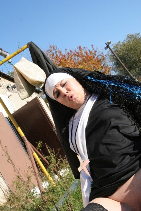 An unsightly nun in tights kneels as Janine prepare for outdoor intercourse with oral sex.