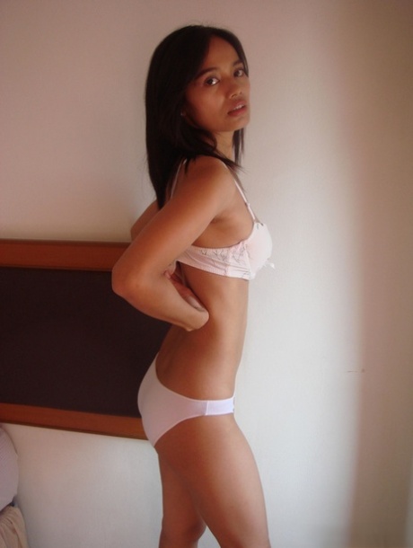 After performing a strip-tease, Lana, the seductive Asian female, flicks fingers at her well-manicured pussy.