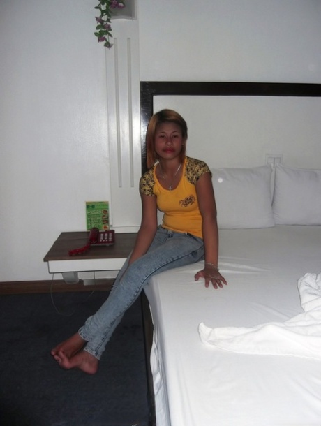 The attractive breasts of amateur Asian babe Wella Saad are nuded in her photoshoot.